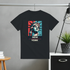 Black t-shirt with Statue of Liberty graphic and 'New York' text on a gray wall background.