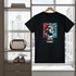 Black t-shirt with Statue of Liberty graphic on a hanger in front of a window with cityscape view.